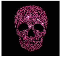 a pink skull with leopard print on it's face is shown in the dark