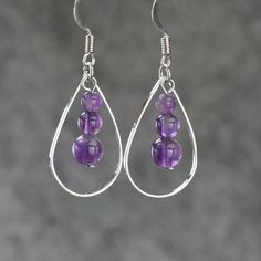 "The tear drop hoop earrings are handmade using amethyst, or coral, or turquoise. Free US shipping. Customers who purchased this item said: \"Very pretty, love these earrings \" The length of the earrings is 1 inches, or 2.5cm. (excluding the length of hook) Earrings are worn so close to the face, they are the most important accessories because it will siphon attention to our face. Earrings can compliment our face shape, enhance our good features, soften the jaw line, bring out the color of the Hoop Earrings With Round Natural Stones For Gift, Wire Wrapped Hoop Earrings For Jewelry Making, Gift Sterling Silver Wire Wrapped Beaded Earrings, Wire Wrapped Beaded Earrings As Gift, Handmade Sterling Silver Drop Hoop Earrings, Handmade Crystal Hoop Earrings For Gift, Hypoallergenic Purple Dangle Teardrop Earrings, Spiritual Hoop Jewelry As Gift, Wire Wrapped Teardrop Beaded Earrings Gift