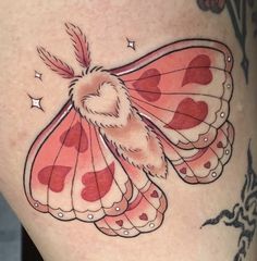 a woman's thigh with a pink and red butterfly tattoo design on the side