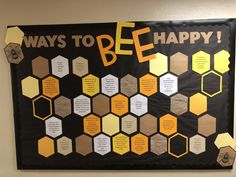 a bulletin board that says ways to be happy with honeycombs and words on it