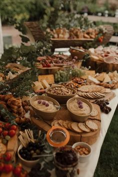 a table filled with lots of food and snacks