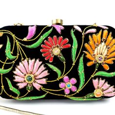 Turn heads wearing this colorful floral embroidered black velvet evening clutch bag. Be bright and bold! This exclusive design is expertly hand embroidered by master zardozi artisans. Each petal and leaf is outlined with glittery metallic gold threads and embellished with genuine semi precious stones, including garnets, turquoise, carnelian and onyx. Shop sustainably - own a handbag of exceptional quality that you will keep forever and pass down to the next generation. View more exclusive embroi Embroidered Multicolor Clutch For Evening, Multicolor Embroidered Clutch For Evening, Multicolor Embroidered Evening Bag, Embroidered Multicolor Evening Bag, Multicolor Evening Clutch With Zari Work, Evening Multicolor Clutch With Zari Work, Traditional Multicolor Clutch For Evening, Floral Embroidered Clutch For Party And Festivals, Festive Floral Embroidery Evening Bag For Party