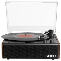 an old fashioned record player with its turntable and clear plastic case on white background