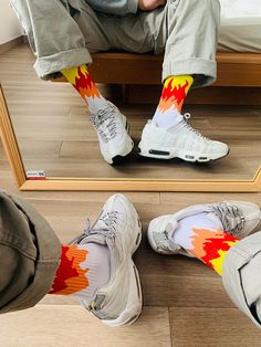 Ignite your street style with our versatile fire socks. Introducing our latest creation for the urban fashion frontier: the flame socks. These are a testament to the young urbanites who dare to stand out and tread with passion. With intricate flame designs adorning their silhouette, these socks aren't just stylish; they define a new era of urban sophistication. These men's flame socks are more than an accessory for the discerning gentleman navigating the city's concrete jungles. They are a proclamation of style, an assertion of individuality. As you stride forward, these fire-flame socks cover your feet but also illuminate your path, setting every step ablaze with audacity. Durable, comfortable and flamboyantly crafted, these fiery socks enhance your ensembles. Size: 37-43 Ultra-resistant Flame Socks, Apocalyptic Clothing, Techwear Pants, Urban Sophistication, Fire Flame, Flame Design, Chest Rig, Concrete Jungle, The Flame