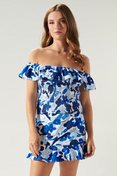 Cool like the sea, this blue abstract floral print embodies the perfect top for a warm day out to brunch. It features an off the shoulder design with a ruffle detail that sweeps from shoulder to shoulder. The bodice is fully smocked to create a flattering fit that ends right at the hips. Wear it with bottoms of your choice or complete the coord set with the matching skirt.- Smocked- Off the shoulder- Ruffle detail- Color: White BlueSize + Fit - Model is 5'9" and wearing size XS- Measurements tak Summer Blue Smocked Back Top, Blue Smocked Back Top For Summer, Blue Smocked Top For Summer, Blue Smocked Top For Vacation, Blue Smocked Top For Summer Brunch, Blue Smocked Top With Smocked Back For Summer, Blue Smocked Top With Smocked Back For Vacation, Beach Smocked Top With Ruffles, Summer Floral Print Pool Tops