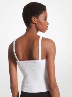 The minimal design of this tank top means it can be worn throughout the warmer months with ease. Defined by a halter neckline, it’s cut from a ribbed viscose blend infused with stretch for a flattering, body-hugging fit. For a chic yet relaxed look, style it with tonal pants in a wide-leg silhouette. Modern Fitted Tank Top For Summer, Fitted Ribbed Tops With Tank Straps, Modern Seamless Fitted Tops, Spring Seamless Tank Top With Minimal Stretch, Seamless Tank Halter Top For Spring, Modern Seamless Tops For Spring, Seamless Sleeveless Halter Top For Spring, Ribbed Tank Top With Minimal Stretch For Spring, Modern Fitted Tank Top For Spring