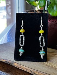 Czech glass turquoise and yellow beads with silver accents. 2 1/4 inches in length Turquoise Earrings With Colorful Czech Glass Beads, Yellow Large Beaded Dangle Jewelry, Unique Yellow Nickel-free Jewelry, Yellow Beaded Czech Glass Earrings, Yellow Beaded Earrings In Czech Glass, Yellow Beaded Earrings With Czech Glass, Yellow Czech Glass Beaded Dangle Earrings, Handmade Yellow Beaded Earrings With Czech Glass, Nickel Free Yellow Dangle Beaded Earrings