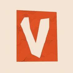 the letter v is made up of pieces of orange paper with white letters on it