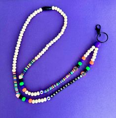 What a spooky way to start your day! This listing is for the personalized lanyard only. The bead colors will include, purple, lime green, bright orange, black, and wood beads (look at pics). The small focal beads within the lanyard will vary but will be Halloween themed.  Lanyard length can be chosen from the drop down menu. 18 inches is standard. This measurement goes from the breakaway clasp to the bottom bead (does not include the jump ring and clasp)  Letters for personalization can be white with black as shown in the pics. Name/Wording will be placed top to bottom (see pic) You can personalize it with a name, phrase, or special wording. Use the personalization section to personalize your item. This listing will stay true to the color combo used in the pics. If you'd like something els Trendy Adjustable Lanyards As Gifts, Personalized Black Lanyards As Gift, Personalized Black Lanyard For Gift, Personalized Black Lanyards For Gifts, White Adjustable Fun Lanyards, Customizable White Lanyards, Personalized White Lanyards For School, Customizable Lanyards As Gifts, Customizable White Lanyards As Gifts