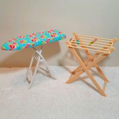 an ironing board next to a toy ironing board