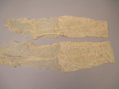 "Handmade lace sleeves from a Victorian era dress. The Victorian lace dress sleeves are beige in color. These Victorian fabric lace sleeves have a gorgeous floral lace design. These antique lace dress sleeves would be gorgeous for a Victorian wedding dress, or for a Vintage lace wedding dress. The Beige lace sleeves are in very good condition to age. The  antique lace dress Sleeves have some light shatter to the silk. Each Victorian dress Sleeve measures 22\"L and are 5 1/2\"W. SHIPPING: Once your order is processed you can expect your package to ship the next business day and arrive in 2 to 5 business days. MORE: Like what you see? Find more listings in my shop here: https://www.etsy.com/shop/mmmoonchild Message me if you have any more questions!" Fitted Lace Dress For Daywear, Daywear Lace Dress With Lace Patchwork, Fitted Beige Lace Dress With Lace Work, Cream Lace Dress With Lace Sleeves, Fitted Victorian Lace With Lace Trim, Elegant Fitted Lace For Daywear, Fitted Cream Lace With Patchwork Detail, Fitted Cream Lace With Lace Patchwork, Fitted Beige Crochet Lace