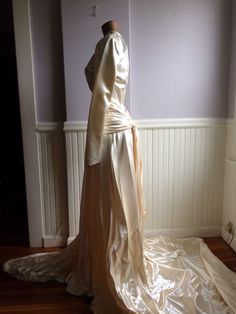 "Custom designed wedding gown from the late 1940's (1948-49) . Made for a woman who was approximately 115- 120 lbs and approximately 5'7\" tall. This gown could have be made by designer Caroline Herrera the workmanship and simple elegance screams her namesake. The icy pink satin is stunning in this gowns design, as is the pleated bustle back. Measurements are; Armpit to armpit Waist Feel free to convo me with any further questions. Thank you for your interest." Fitted Wedding Dress With Historical Design, Fitted Wedding Gown With Historical Design, Vintage Cream Wedding Dress With Fitted Bodice, Vintage Wedding Dress With Fitted Bodice, Vintage Floor-length Wedding Gown, Vintage Fitted Wedding Gown, Cream Vintage Wedding Dress With Fitted Bodice, Vintage Fitted Gown With Historical Design, Vintage Gown With Fitted Bodice For Wedding Night