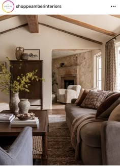 a living room filled with furniture and a fire place