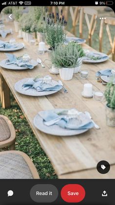 an outdoor table set with plates and place settings