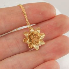 This lotus flower pendant makes for such a sweet and feminine necklace. The details on the lotus are so delicate and timeless, and it's just such a cute size. I love the little capillaries visible in the petals and the little sprigs in the center of the flower. The details really are just perfect and so very dainty. I've kept everything as minimal as possible, and made the option of adding some stellar amethyst cushion cut dangles if you want some sparkle to go with the slightly matte flower. Re Luxury Traditional Flower Pendant Jewelry, Cheap Elegant Flower Pendant Jewelry, Cheap Elegant Flower Pendant Necklace, Affordable Bohemian Flower Pendant Necklace, Cheap Gold Charm Necklace With Flower Pendant, Luxury Flower Pendant Necklace As Gift, Luxury Flower-shaped Necklace For Gift, Affordable Gold Adjustable Flower Necklace, Luxury Gold Flower Pendant Necklace