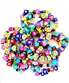 a bunch of colorful beads with smiley faces on them