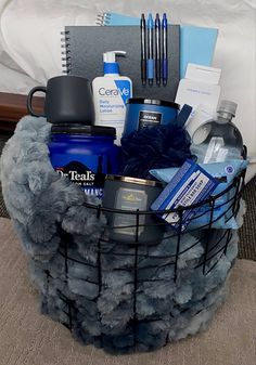 a basket filled with items sitting on top of a bed