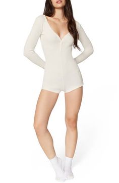 Love to lounge in this soft cotton-blend romper designed with fine allover ribbing. 27 1/2" length Button half placket V-neck Long sleeves 58% cotton, 39% recycled polyester, 3% elastane Machine wash, tumble dry Imported Casual V-neck Bodysuit For Loungewear, Casual Ribbed Bodysuit For Loungewear, Ribbed V-neck Jumpsuit For Loungewear, Spring Ribbed Loungewear Bodysuit, Spring Ribbed Bodysuit For Loungewear, Long Sleeve Ribbed Jumpsuits And Rompers For Loungewear, White Ribbed Bodysuit For Loungewear, White V-neck Bodysuit For Loungewear, Casual Bodysuit For Relaxation