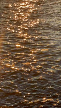 the sun shines brightly on the water as it reflects off the surface of the ocean