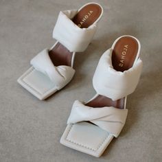 An Open Toe Off-White Mule That Will Add A Pop Of Fun To Any Day To Night Outfit. Simplicity At Its Finest With A Mid-Heel That Makes This Shoe Style All The More Special. A Perfect Mule To Combine With Jeans And Create A Casual Look Of The Most Incredible. If You Are Between Two Sizes, We Recommend One Size Up. New With Tag. Never Worn. Authentic %. White Sandals With Padded Heel, White Heels With Heel Loop, White Sandals With Branded Heel Counter, White Flat Heel Sandals With Branded Heel Counter, White Round Toe Sandals With Padded Heel, White Flats For Spring, White Heels With Square Toe, White Sandals With Padded Heel And Closed Toe, White Sandals With Medium Width