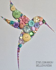 a bird made out of buttons and beads