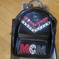 Limited Edition Very Rare Backpack Black With Mcm Letters And Studded Chevron In Red, White And Gray. Approx. 13" H X 10" W X 5" D Never Used. Partially Unwrapped, Mint Condition. Mcm Box Designer Leather School Bag, Designer School Bag With Adjustable Strap, Designer Logo Standard Backpack, Luxury School Bags With Logo, Mcm Bags, Mini Backpack, Black Backpack, Very Rare, Mint Condition