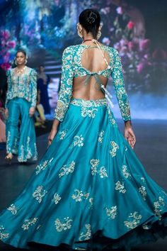 Turquoise blue panelled lehenga featuring zardozi-zari embroidered floral motifs, embellished by beads, sequins, pearls along with attached can can. Comes with embroidered padded crop top in cut-out silhouette. - Aza Fashions Turquoise Bollywood Choli For Receptions, Anarkali Style Turquoise Choli For Wedding, Bollywood Style Turquoise Choli For Reception, Traditional Turquoise Choli For Reception, Bollywood Turquoise Choli For Reception, Fitted Turquoise Lehenga With Zari Work, Turquoise Bollywood Choli With Resham Embroidery, Fitted Turquoise Choli With Zari Work, Anarkali Turquoise Choli For Wedding