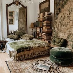 a bedroom with a large bed and lots of books on the wall next to it