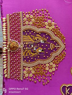 an intricately designed purple cloth with gold beads and bead work on it,