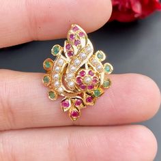 Boasting a sophisticated multicoloured jadau ring in 22ct gold, this timeless piece offers an alluring floral design. Weighing 4.4 GMs, its combination of style and resilience make it an apt accessory for any ensemble or event. Handcrafted with expertise, it promises a high-quality finish. Price Breakup Summary Component Rupees % of Total 22k Gold 21,384 74.0% Stones & Beads 1,848 6.4% Making Charges 3,849 13.3% Taxes (GST) 812 3.0% Total 28,894 100.0% View Detailed Price Breakup Watch Video Here Baby Rings Gold, Emerald Ring Design, Ladies Gold Rings, 22k Gold Jewelry Necklaces, Jewel Design, Antique Gold Earrings, 22k Gold Jewelry, Wedding Blouse Designs, Gold Bridal Jewellery Sets