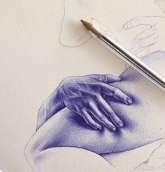 a pencil drawing of a woman's stomach with her hand on the belly, and a pen resting next to it