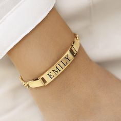 Celebrate your unique identity and style with our Custom Engraved 18k Gold Plated Bracelet. This delicate and elegant bracelet features a sleek gold bar that can be engraved with the name of your choice, making it a perfect personalized accessory or thoughtful gift for a loved one. Whether you're treating yourself or surprising someone special, this bracelet adds a touch of sophistication to any outfit. The bar measures a generous 30mm x 4mm, providing ample space for a clear and stylish engravi Lingot D'or, Elegant Bracelet, Name Bracelet, Gold Plated Bracelets, Gold Bar, Personalized Accessories, Charm Bracelets, Custom Engraving, Thoughtful Gifts