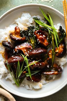 a white bowl filled with rice and vegetables