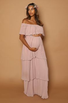 The Lala Layered Gown is flowy, flirty and flattering, with her off the shoulder detail and flowing pleated fabric the Lala Gown having you looking chic but also feeling comfortable. Color Options: Mauve Pink, Royal Blue, Blue Floral, Pink Floral, White Floral Spring Baby Shower Outfit For Mom, Jumpsuit Pregnant, Pink Baby Shower Dress, Babyshower Dress, Maternity Evening, Pink Maternity Dress, Layered Gown, Cute Maternity Dresses, Plus Size Maternity Dresses