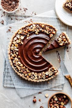 there is a chocolate pie with nuts on it