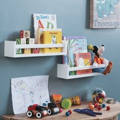 a child's room with toys and books on the shelves