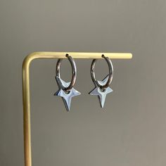 - These Star Earrings are perfect for anyone looking to add a hint of grunge to their look, incredibly unique cool girl vibe star hoops.  -These earrings are made entirely of stainless steel, making them hypoallergenic, TARNISH-FREE, as well as lead and nickel-free. 💕 - Lightweight, super comfortable to wear.  -Shipping: All orders will be shipped out within 1-2 business days after the order has been received. Ship from New York, United States. USPS first class mail on this order. 🚗 - Thank yo Hoop Earrings Y2k, Holiday Party Earrings, Grunge Star, Earrings Y2k, Star Celestial, Girl Vibe, Celestial Earrings, Cute Star, Dangle Hoop Earrings