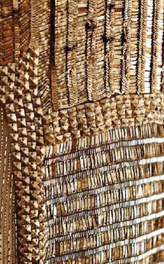 woven wall hangings made out of wicker and wood sticks, with different patterns on them