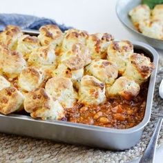 a pan filled with food sitting on top of a table