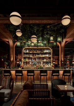 the bar is decorated with plants and lights