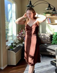 "Needing a versatile slip dress in your wardrobe? This slip dress is perfect for that! The slip dress structure makes it perfect for the summer to be nice and cool and the brown color makes it easy to layer and warm up to wear in the colder months. The addition of the waist strings helps if you want to snitch around your waist!  The dress would be perfect for someone who is a size small/medium.  Condition: Good condition, no noticeable issues. Measurements are taken with items lying flat on the Spring Brown Fitted Slip Dress, Fitted Brown Slip Dress For Spring, Brown Fitted V-neck Slip Dress, Chic Fitted Brown Slip Dress, Brown Fitted Midi Dress For Summer, Fitted Brown Midi Dress For Summer, Fitted Brown Slip Dress, Chic Brown Midi Dress With Spaghetti Straps, Brown Spaghetti Strap Midi Dress For Summer