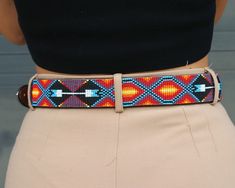 Leather beaded belt with removable Grace buckle. Ipanema design (southwestern inspired).If you don't see your size, send an email to sales@sambboho.com. We can make the belt in any sizes you want. This belt is part of our made to order collection. Estimated delivery date for made to order items is 15-20 business days (includes processing+ shipping time). Very unique and long lasting Brazilian leather belts. Fully handmade. Beautiful art pieces made of un-dyed full grain leather and Slovakian gla Women's Belts, Beaded Belt, Vogue Magazine, Bead Leather, Leather Belts, Long Pants, Belts For Women, Full Grain Leather, Hand Stitching