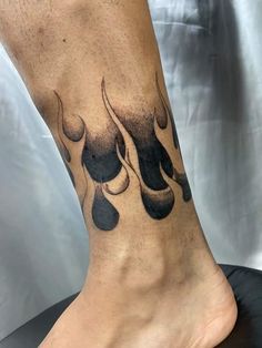 a man's foot with black ink on it