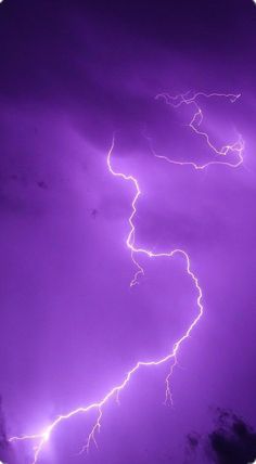 a purple sky filled with lots of lightning