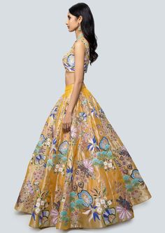 Multicolored amber applique and embellished kali tissue lehenga with sleeveless blouse and floral border net dupatta. Silk Anarkali Set With Floral Embroidery In Yellow, Silk Yellow Sharara With Floral Embroidery, Yellow Silk Sharara With Floral Embroidery, Bollywood Style Sleeveless Organza Dress, Navratri Floral Embroidered Organza Sharara, Navratri Organza Sharara With Floral Embroidery, Sleeveless Anarkali Set With Intricate Embroidery For Party, Sleeveless Silk Choli With Intricate Embroidery, Festive Multicolor Sleeveless Gown