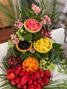 a platter filled with lots of different types of fruits and vegtables