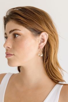 Add a playful touch to your everyday look with the Joni Earrings. Featuring a twisted hoops that comes together as a teardrbop design, these earrings are sure to make a statement. Lead and Nickel Compliant Lightweight Post Backing Dangly Twisted Teardrop Design Gold Nickel-free Dangle Drop Earrings, Everyday Hypoallergenic Teardrop Linear Earrings, Modern Twist Teardrop Earrings Gift, Everyday Pierced Teardrop Pendant Earrings, Single Teardrop Earring, Teardrop Earrings With A Modern Twist As A Gift, Everyday Teardrop Pendant Pierced Earrings, Everyday Metal Teardrop Earrings, Modern Pierced Drop Earrings