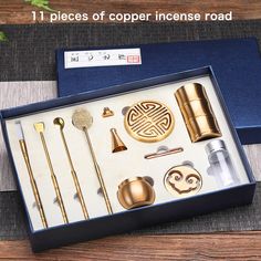 an assortment of golden items in a blue box