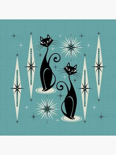 two black cats sitting next to each other on top of a blue background with stars