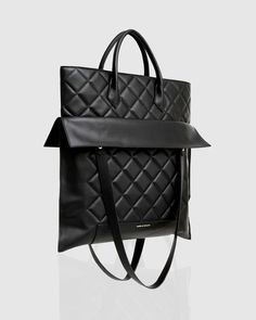 Upgrade your go-to carryall with the sophisticated Lost Lovers Quilted Leather Tote. Crafted from softly quilted genuine leather with a spacious interior, this classic bag will fit all your essentials without compromising on style. - Genuine leather with exclusive quilted texture - Satchel/Shoulder bag strap options - Belle & Bloom printed Nylon lining - Inner phone and zipper pockets- Colour: Black   If any part gets dirty, we recommend wiping and spot-cleaning them with a soft cloth dampened with water. Do not bleach. Avoid contact with any substance containing oil or alcohol, and do not use any abrasive cleaning products. Men's Shoes Accessories, Leopard Print Shoes, Wedding Engagement Gifts, Classic Bags, Clutch Pouch, Fragrance Gift Set, Fragrance Design, Leather Cleaning, Quilted Leather